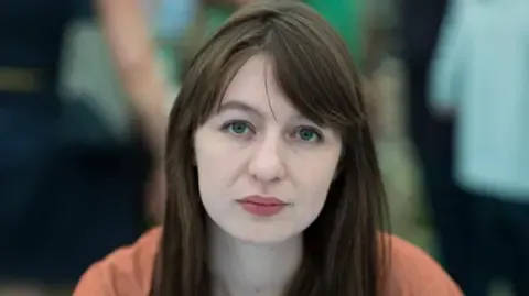 Irish author Sally Rooney declares she is unable to travel to the UK over potential arrest